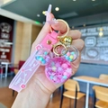 Macro view of pink Mickey liquid quicksand keychain with Happy Moment silicone strap - Pink Luminous Snowflake Mickey Head