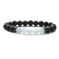 Detail of matte black beads and blue faceted stones on a stretch beaded bracelet - Matte + Diamond Facet