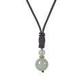 Detail of green tiger eye stones on hand-woven necklace cord with golden metal spacer - Green Aventurine