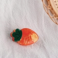 Cute orange carrot shaped hair claw clip made of premium acetate on white fabric - Carrot
