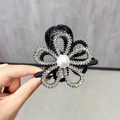 Elegant black hair claw clip featuring rhinestones, pearls, and a hollow flower design - Rhinestone Flower / Silver