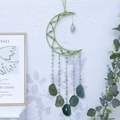 Green moon dream catcher with natural agate slices and crystals hanging on a white wall - Moon Stone - Green