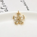 Macro view of gold flower pendant with zircons and dual connection loops for DIY jewelry - Light Blue