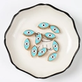 Bulk light blue evil eye charms with golden base and enamel finish for jewelry making - 19*11*5mm 10Pcs/Pack / Light Blue