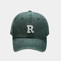 Detailed close-up of white embroidered letter R on washed dark green baseball cap - Adjustable / Green