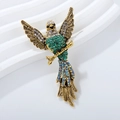 Broche de águila vintage en metal dorado con brillantes cristales azules y verdes - Verde Oro Antiguo