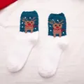 Thick coral fleece Christmas socks featuring reindeer and snowflake patterns in white and blue - One Size / White