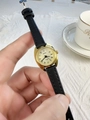 Detailed close-up of a BARSH quartz watch with a gold case and black leather strap - Black Strap