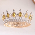 Detailed close-up of a golden bridal crown featuring pear-cut yellow crystals and filigree - Gold Base + Golden Yellow