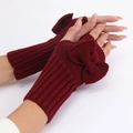 Deep red knit fingerless gloves with bow decoration and warm ribbed wool texture - Burgundy