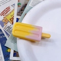 Close-up of a cute yellow and pink gradient popsicle hair clip on a white plate - Pink-Yellow Gradient Popsicle Hair Clip