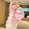 Pink milk tea bear liquid floating bottle keychain with silicone strap and gold hardware - Letter Bead Perfume Bottle - Pink