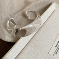 Detailed view of wide transparent resin bangle with wave design on textured fabric - 46# Bracelet-Clear Open Wide