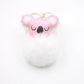 Close-up of pink and white koala fluffy pompom keychain with golden metal clasp - White