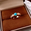 Detail of 18k gold plated open ring with turquoise stone in a velvet jewelry box - Gold Round Turquoise Style