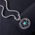 Detailed shot of a silver star pendant with turquoise inlay on a ball chain - Turquoise Star Pendant