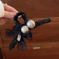 Elegant black lace bow hair claw clip featuring large white pearls and metal spring - Lace Pearl Bow / Black
