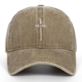 Close-up of white PEACE embroidery and cross on washed cotton khaki baseball cap - One Size / Khaki