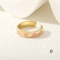 Detailed view of adjustable golden star ring with pink enamel drip oil finish - Pink Stars (RG0441-D)