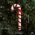 Red and white Christmas candy cane hanger with glitter and red bow on a tree - Large Candy Cane