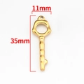 Macro detail of gold-plated key pendant showing 35mm height and 11mm width dimensions - Vacuum 18K Gold Key Pendant 11x35mm