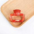 Minimalist translucent orange-red PVC hair claw clip with marble texture design - Bright Orange Texture