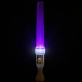 Close-up of a purple LED glow stick with white handle and functional switch button - Show Round Wand Purple