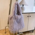 Detail of lavender plush tote bag with soft faux fur texture in a modern room - Light Purple