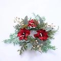 Christmas candle ring featuring red poinsettia flowers with green leaves and gold berries - Christmas Candle Holder No.4