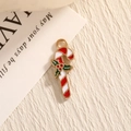 Christmas candy cane pendant in red and white stripes with green holly leaves on beige fabric - Candy Cane / EAR0018/Red White Green Gold
