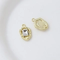 Detailed view of gold alloy heart pendant with zircon stone and textured back surface - Style 19