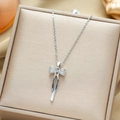 Elegant silver titanium steel necklace with a zircon-encrusted bow pendant on jewelry box - Silver Tassel Bowknot (XL1548-52)