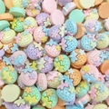Macro view of colorful mini resin strawberry cabochons for DIY crafts and nail art - Strawberry