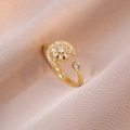Rotating golden moon and sunflower ring with zircon stones on silk background - Rotating Flower Ring (J0348) / Gold