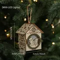 LED wooden Christmas house ornament featuring XMAS carving and snowman motif hanging on tree - Wooden House Colorful Light Style B