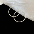 Detailed macro view of silver hoop earrings with sparkling frosted texture on black backdrop - 14# Frosted Glitter Texture Silver Large Hoop (Silver Earring Post)