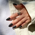Matte black stiletto press-on nails paired with a textured silver snake ring accessory - Matte Black Long Stiletto Shape (JP1942)