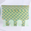 Close-up of a checkered hair claw clip in yellow and green acetate on white background - Cyan + Green Plaid