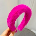 Close-up of soft rose pink plush headband with fluffy texture for hair styling - Rose Red (Solid Plush)
