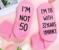 Pink fuzzy socks with I'm not 50 funny anti-slip text and soft coral fleece material - OPP Bag Packaging / Pink-18 with 32 Years Exp