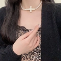 Elegant pearl choker necklace featuring a large golden rhinestone cross pendant on model - Golden Full Rhinestone Large Cross Artificial Pearl Necklace (X4818B)