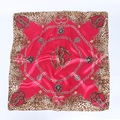 Close-up of leopard print and golden chain pattern on red 90x90cm satin silk scarf - Red Leopard