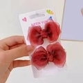 Deep red tulle bow hair clips set for girls on a white branded display card - Bright Red Mesh Pair