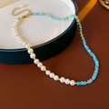 Baroque pearl necklace with blue beads and gold accents on a ceramic tray - Gold Blue White Amazonite Pearl Necklace (#10)