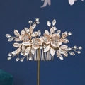 Golden bridal hair comb with crystal flowers and leaves on a dark blue background - Gold Crystal Flower Leaf Style (HS-J4793G)