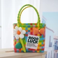 Colorful checkered woven picnic basket with daisy and orange polka dot bow decor - Sunflower Bow Decoration / Rainbow