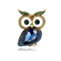Detailed close-up of a vintage owl brooch with large blue teardrop crystal and green eyes - Owl Style (B088-A) / Blue