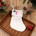 White cable knit Christmas stocking with red letter Y and festive holiday decor - Letter Y