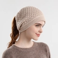 Women's knitted ponytail beanie in beige featuring a practical top opening hole - Beige