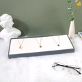 Gray frame necklace display tray with white velvet lining on textured fur background - Inclined Necklace Rack / Gray/White